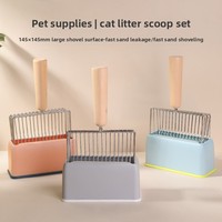 Pelle à litière pour chat en métal au design original avec grande poignée en bois et base colorée en tons pastel