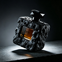 Flacon de parfum carré de luxe à texture roche volcanique, avec logo personnalisé et fenêtre ajourée, flacon de parfum vide