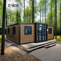ZYBOX Maison conteneur préfabriquée de luxe à structure plate et extensible, avec option mur en verre et terrasse, pour villa, bureau, immeuble, appartement