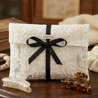 Pochette en dentelle élégante de luxe avec logo personnalisé, sac à bijoux personnalisé pour emballage cadeau de mariage, petit sac mini