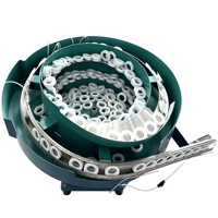 Alimentateur vibrant universel pour tubes en acier de 600 mm max. avec trémie de stockage intégrée pour alimentation