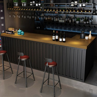 Comptoir de caisse avant en forme de L noir de luxe personnalisé Comptoirs d'accueil de restaurant pour café, bar à vin