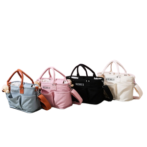 Sac à langer portable multi-poches pour poussette, idéal pour les voyages en extérieur, antivol, imperméable, couleur unie, polyester, grande capacité - Product Image 1