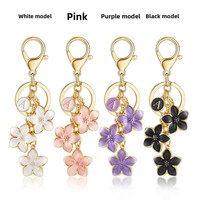 QICHONG Style coréen AliExpress Commerce extérieur Nouveau porte-clés en métal avec pendentif fleur rose 26 lettres pour sac et clé de voiture