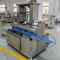 Machine d'alignement automatique de plateaux, arrangeur de plateaux automatique commercial pour la ligne de production de pâtisserie, de gâteaux et de biscuits