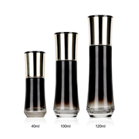 Flacon cosmétique rond en verre noir Noir-Luxe 40ml 100ml avec estampage à chaud doré pour sérum et brume de soin à la vitamine E