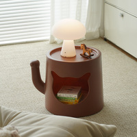 Table basse moderne et simple en forme de niche pour chat, idéale pour les petits appartements et salons, appréciée des humains et des animaux de compagnie, révélée par les influenceurs.