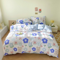 Parure de lit 4 pièces en coton imprimé, douce et agréable pour la peau, comprenant une housse de couette, un drap plat et des taies d'oreiller pour la chambre à coucher.