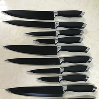 Bas prix en acier inoxydable 2cr14 lame de revêtement antiadhésif PP et TPR manche noir 4pc ensemble de couteaux de cuisine