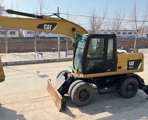 Excavatrice sur pneus CAT M317D2 <span class=keywords><strong>d</strong></span>'occasion à faible nombre <span class=keywords><strong>d</strong></span>'heures de fonctionnement avec dozer frontal, stabilisateurs arrière et ligne de brise-roche préinstallée pour l'asphalte - Product Image 5