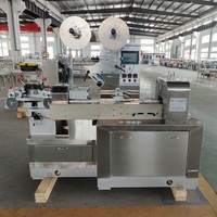 Machine automatique de découpe, de formage et d'emballage en sachet pour barres de caramel et de nougat
