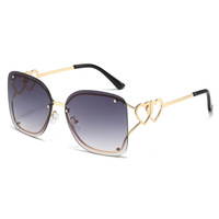Lunettes de soleil de luxe pour femmes, monture métallique sans cadre, style Y2K2025, dégradé, lunettes en forme de cœur chromées