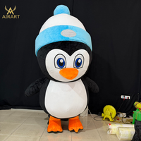 Costume de poupée pingouin en peluche gonflable de dessin animé pour les activités interactives dans les parcs de glace et de neige