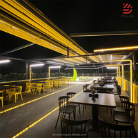 Pergola motorisée pliante moderne avec éclairage LED intégré et écrans zippés pour projets de villas, terrasses et restaurants