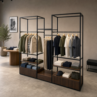 Étagère de présentation haut de gamme en métal noir pour magasin de vêtements pour hommes, mobilier de magasin sur mesure, présentoir personnalisé pour vêtements pour hommes