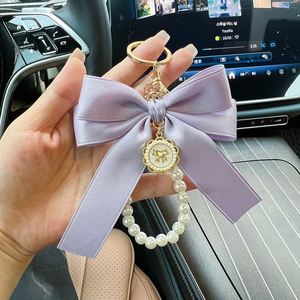 Porte-clés élégant avec nœud et perles pour femme, breloque de sac, support de clés de voiture avec pendentif, porte-clés féminin en soie - Product Image 3
