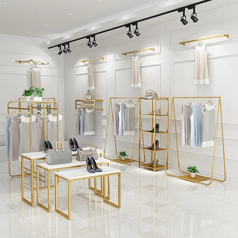 Özel butik altın giyim duvara monte raf yuvalama masa örtüleri raf elbise teşhir rafı giyim mağazası mobilyası
