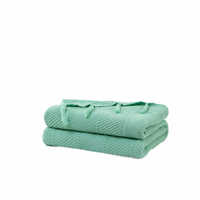Nouvelle arrivée : Couverture en coton tricoté moderne avec pompons pour canapé et hôtel, idéale printemps-automne, pour un intérieur douillet