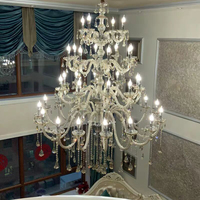 Lampe de lustre à LED en cristal de luxe moderne personnalisée luminaire en fer à hauteur réglable pour escalier Clubhouse Hotel salon