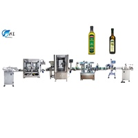 Machine de remplissage et d'étiquetage de capsulage et de boisson énergisante à l'huile de lait lotion entièrement automatique