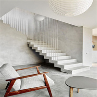 Escalier flottant architectural avec marches en pierre naturelle et structure dissimulée pour maisons de luxe
