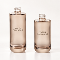 Stock disponible |   Série d'emballages de soins de la peau en verre givré gris fumé de qualité supérieure, flacon luxueux à texture raffinée