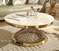 Table basse ronde moderne de luxe écologique et durable avec plateau en marbre et structure en acier inoxydable doré pour salon et salle à manger