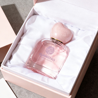 Flacon de parfum en verre transparent rond de 50 ml avec logo imprimé à l'écran et bouchon en forme de cœur, boîte cadeau en satin