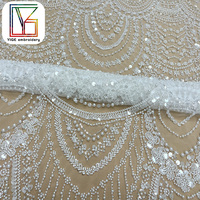 Tissu de robe de mariée africaine haut de gamme en dentelle perlée blanche française avec des paillettes