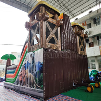 Structure gonflable à thème volcan dinosaure avec toboggan, combo de jeux gonflables pour enfants, idéal pour les fêtes en plein air et les aires de jeux.