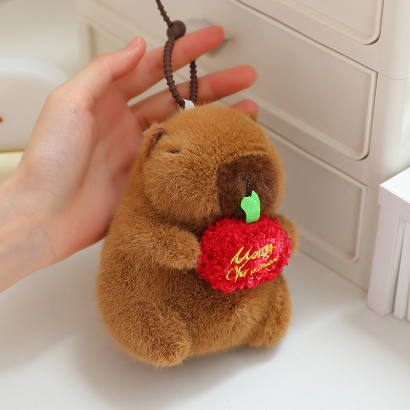 กอดแอปเปิ้ลสีแดง Capybara