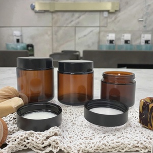 Pot en verre ambré de 30g (1 oz) avec couvercle noir pour cosmétiques, soins de la peau, beurre corporel et crèmes - Product Image 1