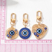 Porte-clés ethnique turc en métal émaillé, forme cœur rond, avec œil bleu porte-bonheur contre le mauvais œil