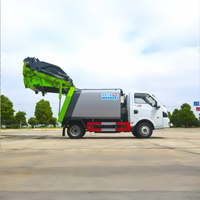 Camion compacteur de déchets Dongfeng Tuyi 3m³ 4x2 avec plaque bleue pour l'élimination des déchets en garage souterrain