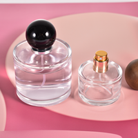 Botol semprotan parfum kaca silinder, semprotan botol parfum kaca bulat kosong 30ml 50ml 100ml dengan tutup hitam