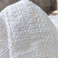 Tissu bouclé en polyester doré ivoire métallisé pour vestes, robes et vêtements haut de gamme