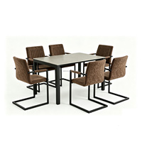 Table de salle à manger au design simple avec plateau rectangulaire en pierre frittée grise et base en métal noir, avec 6 chaises
