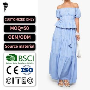 ชุดเซ็ตสองชิ้นสำหรับผู้หญิง เสื้อเปปลัมแขนพองลายทางแบบใหม่ ดีไซน์เก๋ไก๋ พร้อมกระโปรงแม็กซี่ทรงระบาย - Product Image 1