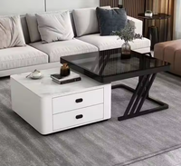 Table basse moderne de luxe avec plateau relevable en pierre frittée, tiroir de rangement et structure en métal noir pour salon