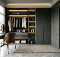 Dressing moderne gris foncé avec armoire intégrée, éclairage LED, coiffeuse et meuble de rangement sur mesure pour chambre à coucher