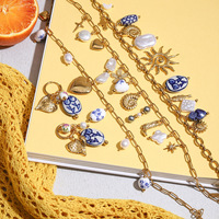 Collier en acier inoxydable avec motif de poisson chrétien, coquillage de soleil, coquille de conque, coquille de perle, plaqué or 18 carats, motif de croix, style océanique tendance