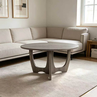 Table basse ronde moderne avec base sculpturale, table centrale polyvalente pour salon, pièce d'appoint élégante pour toute décoration intérieure