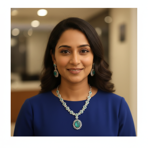 A luxurious necklace and <b>earrings</b> set crafted with radiant emerald green oval stones surrounded by brilliant white <b>halo</b> stones - Product Image 1