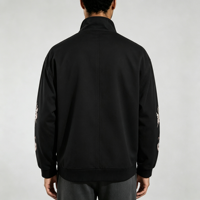 Veste thermique double couche en daim noir avec broderie unie, boutons grenouillère, poches cargo côtelées