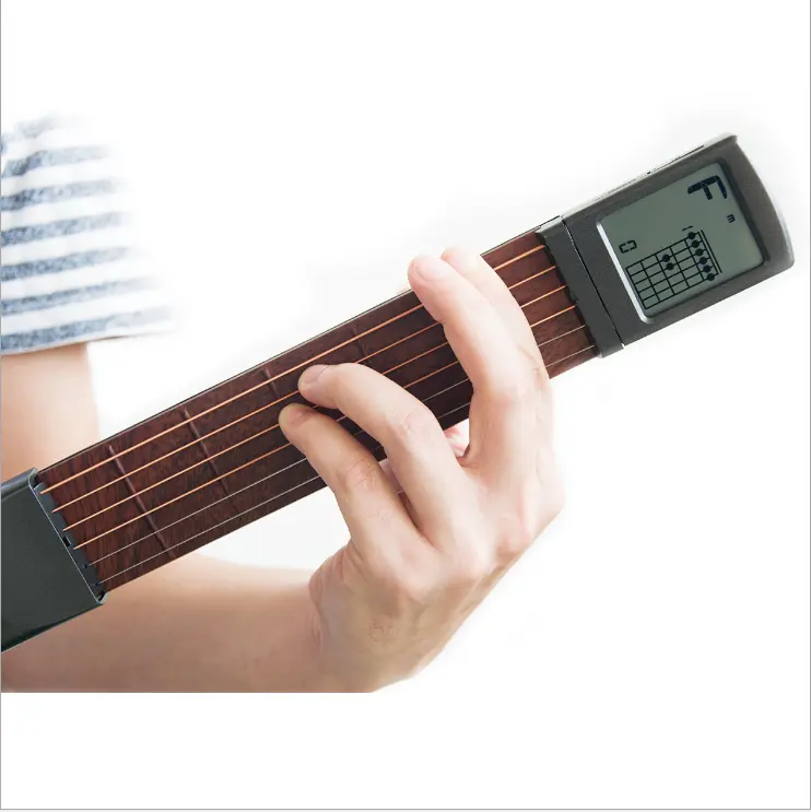 Factory direct sales portable pocket guitar auxiliary artifact chord practice played electric classical accessories for guitar