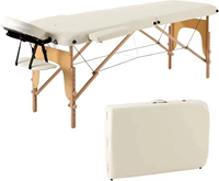 Table de massage pliable portable en cuir synthétique moderne de haute qualité, confortable et durable, idéale pour les salons de beauté, les spas et les massages thaïlandais.