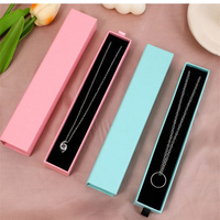 Petite boîte à bijoux en carton avec tiroir coulissant noir et rose, avec insertion en mousse éponge