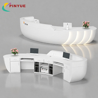 Comptoir de réception circulaire moderne avec éclairage LED dégradé, comptoirs avant multi-niveaux noirs pour bureau, hall d'hôtel, salle d'exposition, personnalisable