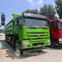 Б/у самосвал SINOTRUK HOWO 8X4 с левым рулем, дизельный, МКПП, двигатель Weichai, Евро-2, грузоподъемность 41-50 т