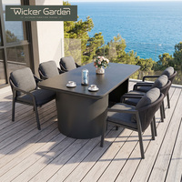 Ensemble de table à manger d'extérieur avec plateau en pierre frittée, structure en aluminium, chaises en corde tressée avec coussins pour jardin et terrasse, vente en gros